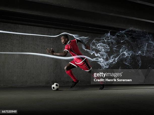 male football/soccer player in windtunnel - football player tunnel stock pictures, royalty-free photos & images