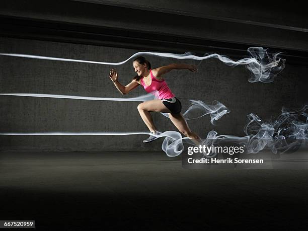female athlete in windtunnel - wind tunnel stock pictures, royalty-free photos & images