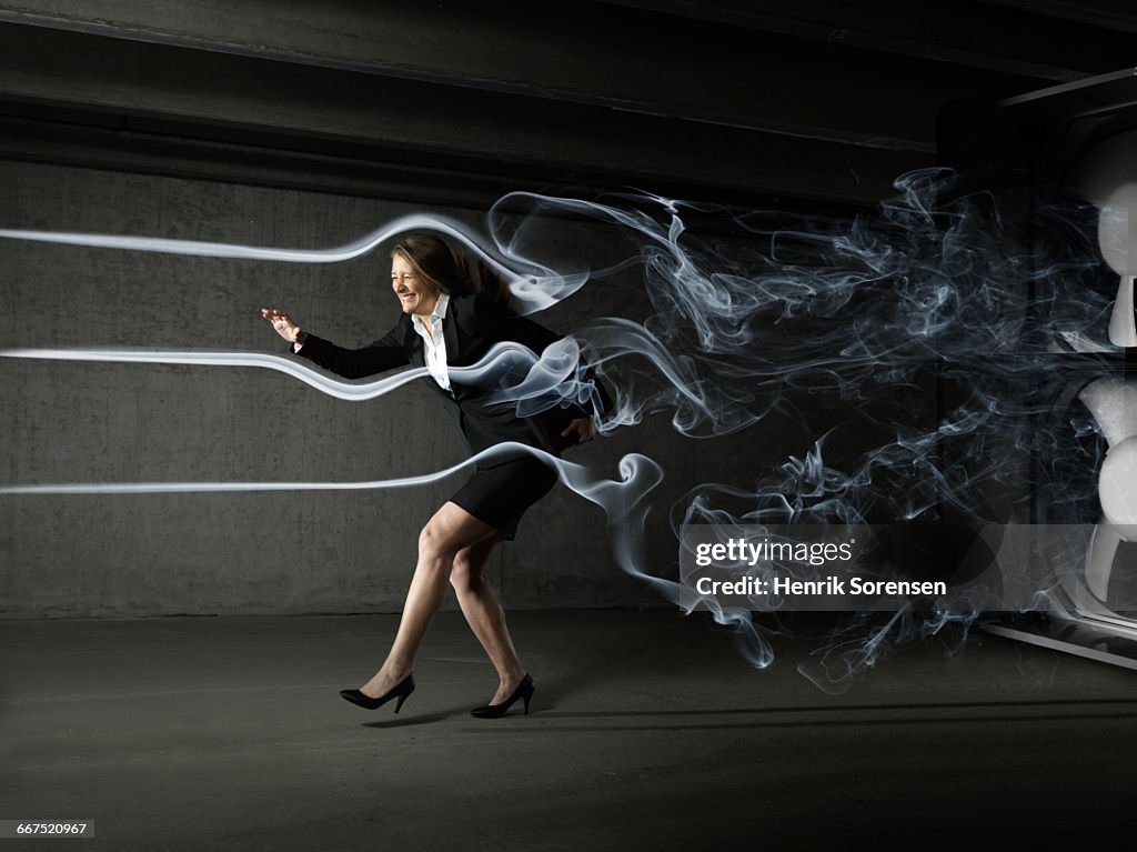Business woman in windtunnel