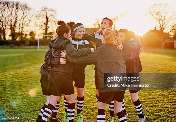 female football team huddling - soccer team celebrating stock pictures, royalty-free photos & images