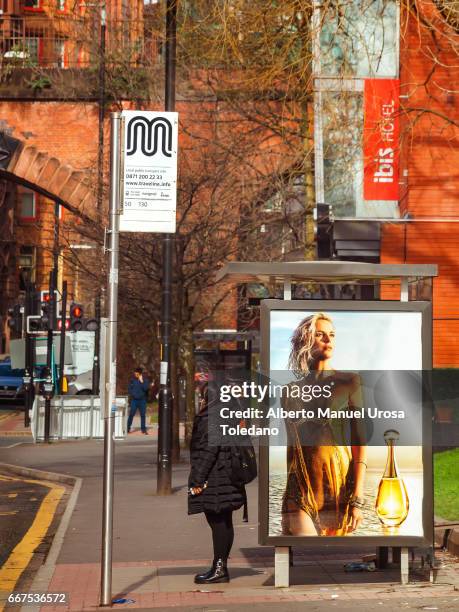 england, manchester, bus stop at brook st. - charlize-theron-young stock pictures, royalty-free photos & images
