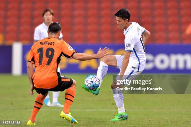 Yamamoto Shuto of the Antlers looks to take on the defence of Jack Hingert of the Roar during the AFC Asian Champions League Group Stage match...