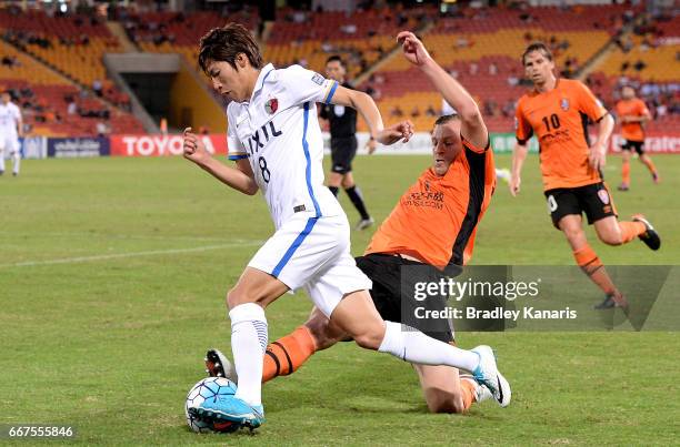 Doi Shoma of the Antlers is tackled by Avram Papadopoulos of the Roar during the AFC Asian Champions League Group Stage match between the Brisbane...