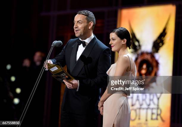 Phoebe Fox and Ben Forster present an award on stage during The Olivier Awards 2017 at Royal Albert Hall on April 9, 2017 in London, England.