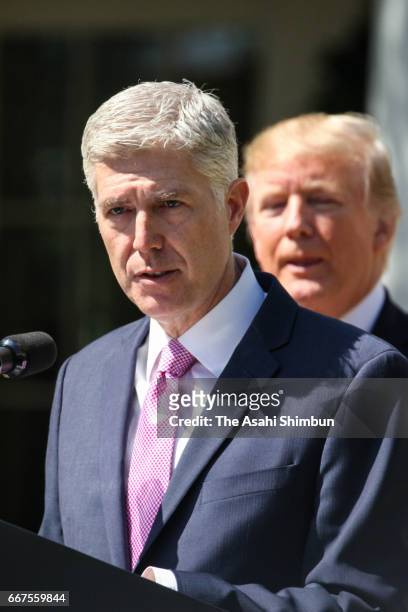 Judge Neil Gorsuch addresses and President Donald Trump looks on during a ceremony in the Rose Garden at the White House on April 10, 2017 in...