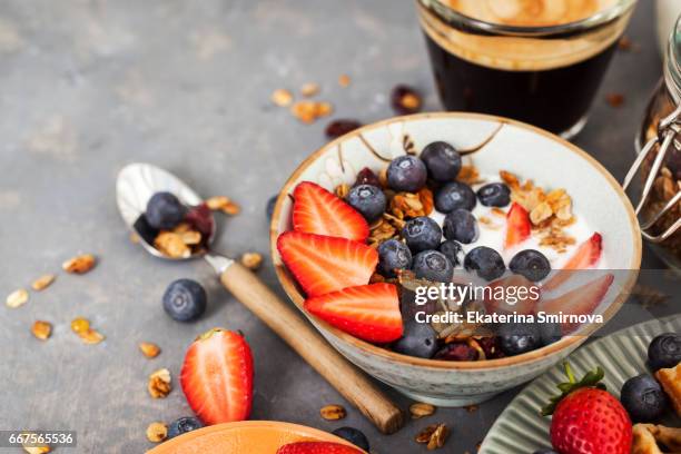 breakfast table with cereal granola, fresh berries and coffee - oatmeal raisin stock pictures, royalty-free photos & images