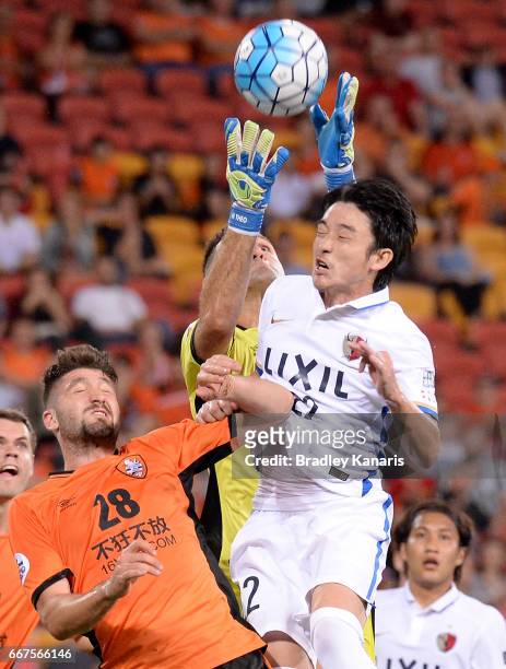 Nishi Daigo of the Antlers competes for the ball against goalkeeper Michael Theo of the Roar during the AFC Asian Champions League Group Stage match...