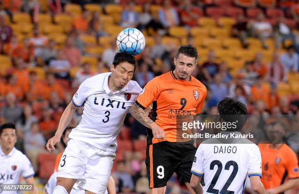 Shoji Gen of the Antlers and Jamie Maclaren of the Roar compete for the ball during the AFC Asian Champions League Group Stage match between the...