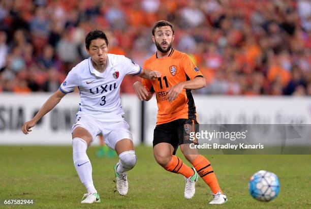 Tommy Oar of the Roar and Shoji Gen of the Antlers compete for the ball during the AFC Asian Champions League Group Stage match between the Brisbane...