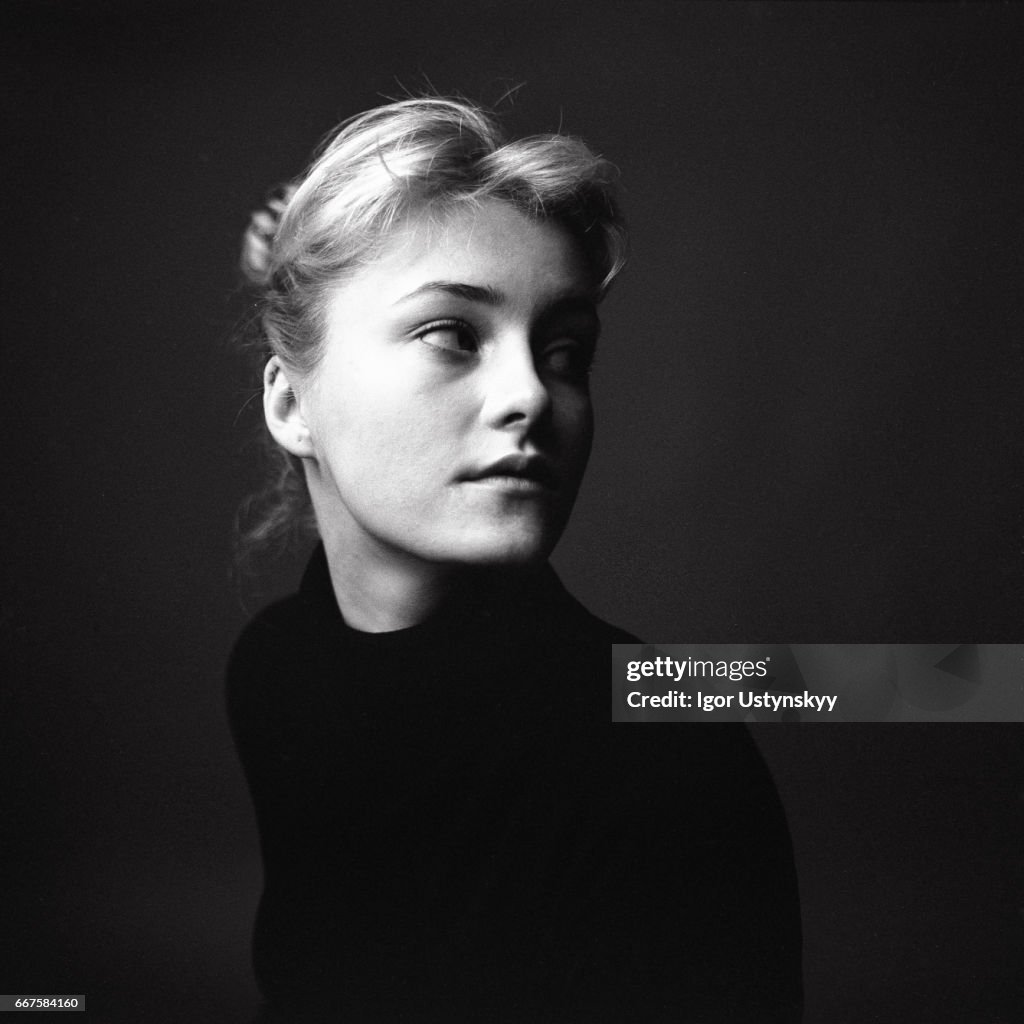 Black and white portrait of woman on the black background
