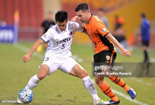 Ueda Naomichi of the Antlers and Jamie Maclaren of the Roar challenge for the ball during the AFC Asian Champions League Group Stage match between...