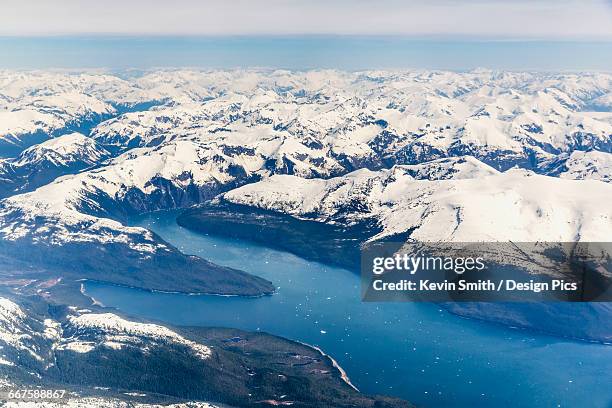 aerial view of a glacier fjord in the inside passage, and snow capped peaks, wrangell, southeast alaska, usa, spring - inside passage stock pictures, royalty-free photos & images