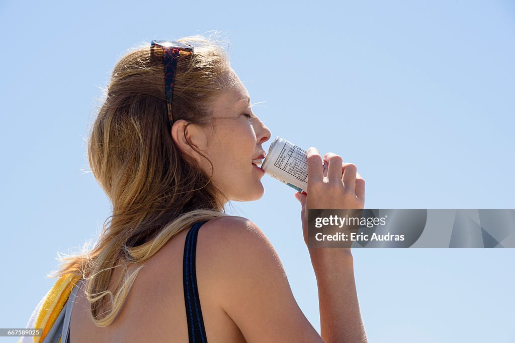 Beautiful woman enjoying cold drink