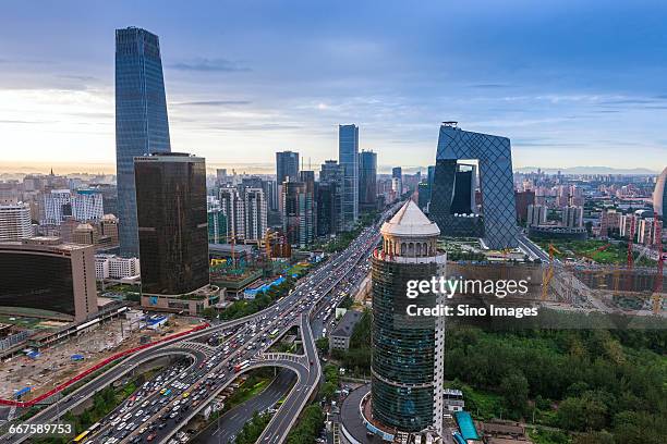 overlooking the china world trade center bridge and the cbd building group at sunset - bridge building glass stock pictures, royalty-free photos & images