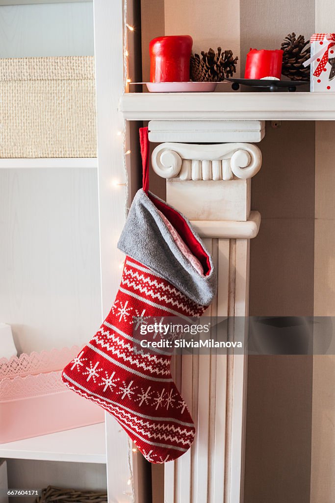 Christmas stocking hanging on fireplace