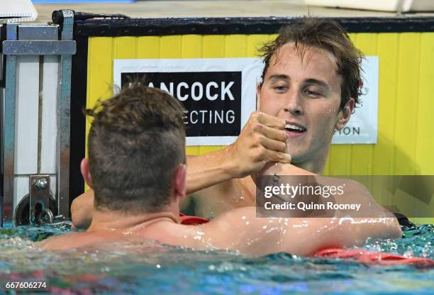 Kyle Chalmers congratulates Cameron McEvoy of Australia on winning the Men's 100m Freestyle during the 2017 Australian Swimming Championships at the...