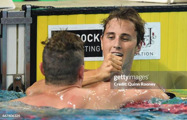 Kyle Chalmers congratulates Cameron McEvoy of Australia on winning the Men's 100m Freestyle during the 2017 Australian Swimming Championships at the...