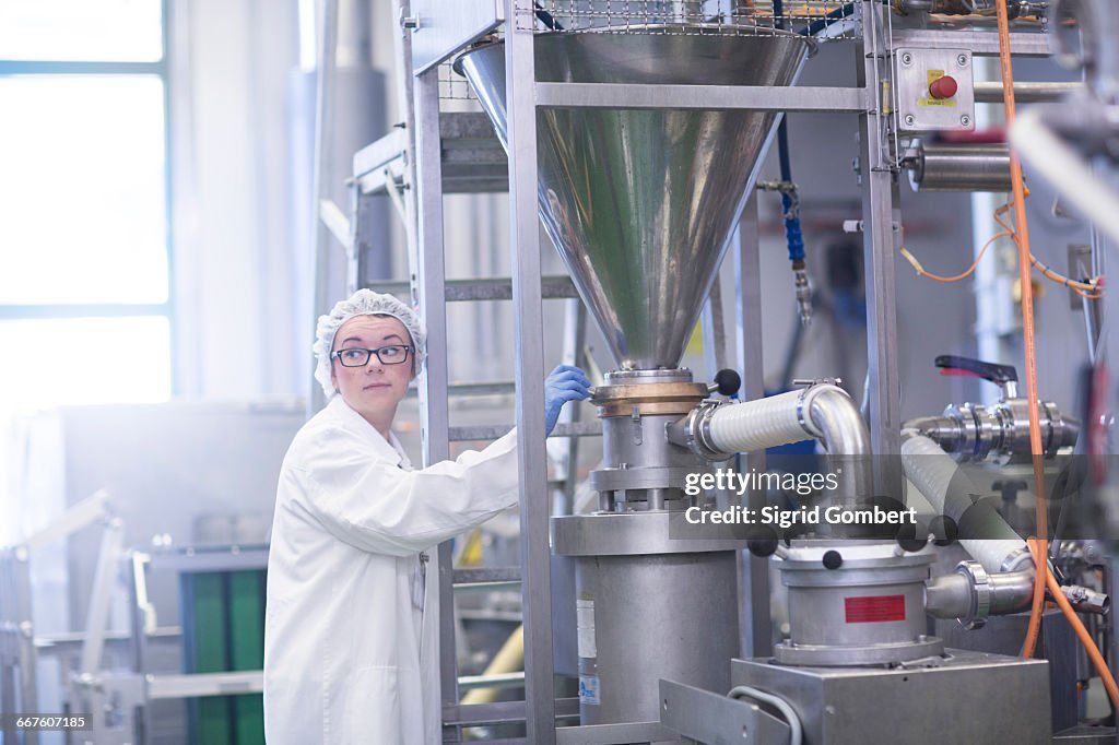 Factory worker working in food production factory