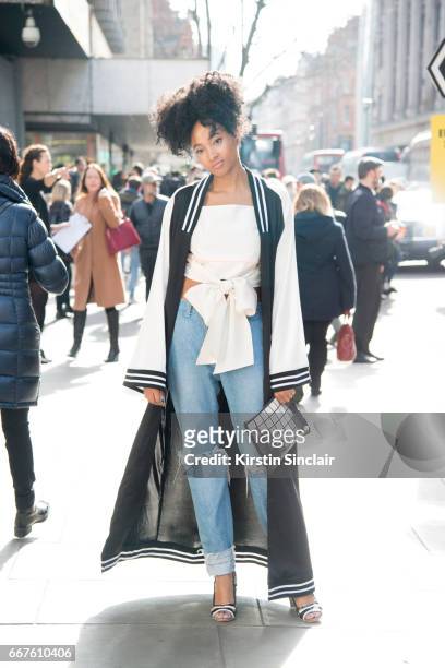 Social media manager and editor for Barneys NYC Candace Marie wears an Asos Kimono, Topshop shoes, Saku Top, Sacai jeans and an Anya Hindmarch bag on...
