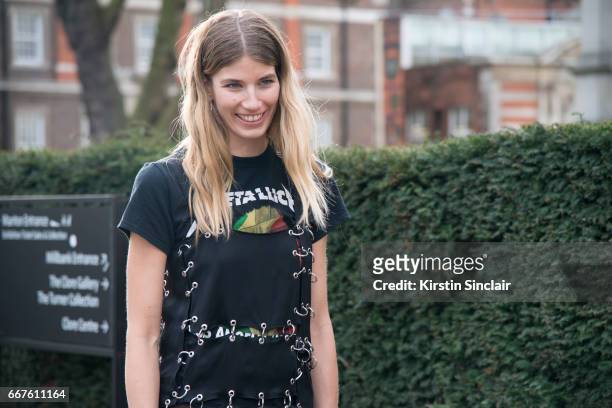 Fahsion writer and founder of hey-woman.com Veronika Heilbrunner wears a Christopher Kane dress and a Metallica t-shirt on day 4 of London Womens...