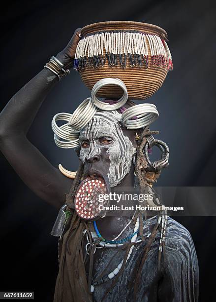 woman of the mursi tribe, omo valley, ethiopia - mursi tribe they stock pictures, royalty-free photos & images