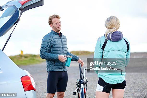 cyclists chatting before ride - wind shelter stock pictures, royalty-free photos & images