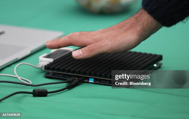 An attendee tests a virtual sensory transducer array board on the Ultrahaptics Ltd. Stand at the Virtual Reality World Congress in Bristol, U.K., on...