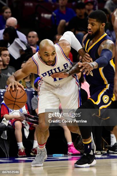 Gerald Henderson of the Philadelphia 76ers drives against Paul George of the Indiana Pacers during the first quarter at the Wells Fargo Center on...