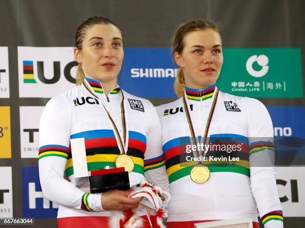 Daria Shmeleva and Anastasiia Voinova of Russia pose with their gold medals after winning the Women's Team Sprint on day one of the 2017 UCI Track...