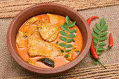 Top view of spicy and hot king fish curry Kerala Indian food