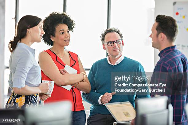 business meeting in tech start-up office - gary burchell stock pictures, royalty-free photos & images