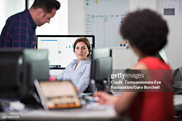 business people working in tech start-up office - gary burchell stock pictures, royalty-free photos & images