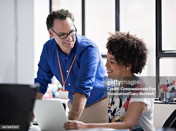 business people working in tech start-up office - gary burchell stock pictures, royalty-free photos & images