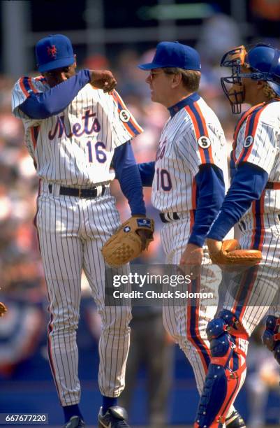New York Mets Dwight Gooden with manager Jeff Torborg and Charlie O'Brien during game vs Montreal Expos at Shea Stadium. Flushing, NY 4/10/1992...