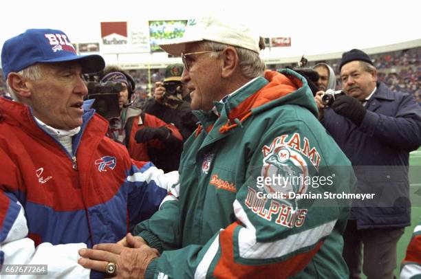 Playoffs: Buffalo Bills coach Marv Levy shaking hands with Miami Dolphins coach Don Shula after game at Rich Stadium. Orchard Park, NY CREDIT: Damian...