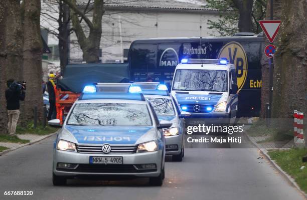 The Dortmund team coach, escorted by police arrives for the UEFA Champions League Quarter Final first leg match between Borussia Dortmund and AS...