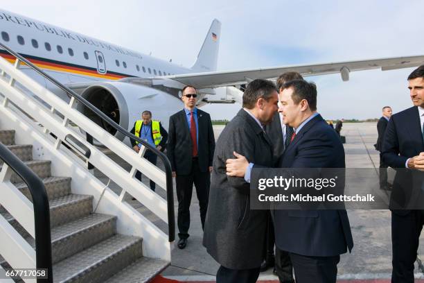 Serbia's Foreign Minister Ivica Dacic welcomes German Foreign Minister and Vice Chancellor Sigmar Gabriel at the airport during his visit to Serbia...