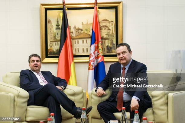 Serbia's Foreign Minister Ivica Dacic welcomes German Foreign Minister and Vice Chancellor Sigmar Gabriel at the airport during his visit to Serbia...