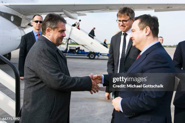 Serbias Foreign Minister Ivica Dacic welcomes German Foreign Minister and Vice Chancellor Sigmar Gabriel at the airport during his visit to Serbia on...