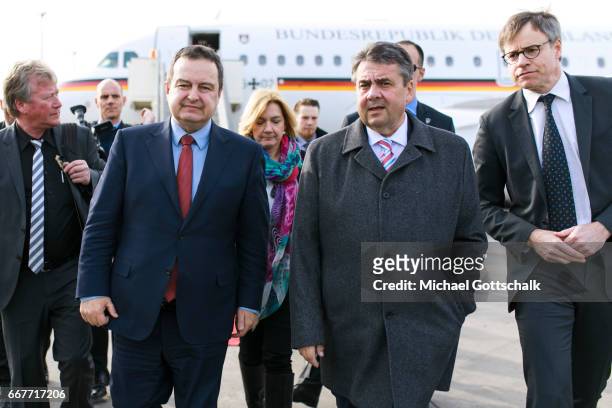 Serbia's Foreign Minister Ivica Dacic welcomes German Foreign Minister and Vice Chancellor Sigmar Gabriel at the airport during his visit to Serbia...
