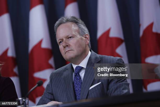 Stephen Poloz, governor of the Bank of Canada, listens during a news conference at the National Press Theatre in Ottawa, Ontario, Canada, on...
