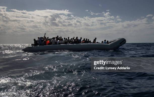 Italian troops with the Uraniam Navy Ship rescue African migrants from Gambia, Mali, Senegal, Ivory Coast, Guinea, and Nigeria, from a rubber boat in...