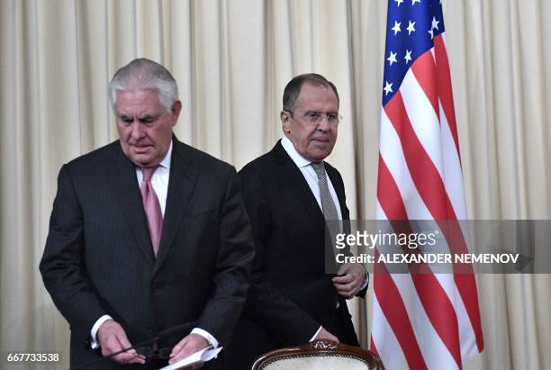Russian Foreign Minister Sergei Lavrov and US Secretary of State Rex Tillerson arrive to attend a press conferece after their talks in Moscow on...