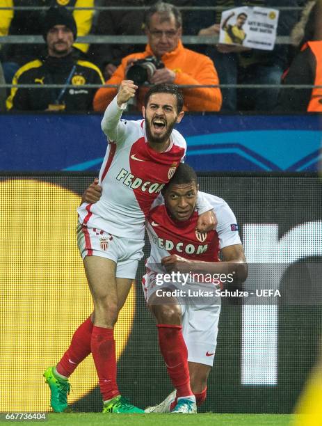 Kylian Mbappe and Bernardo Silva of Monaco celebrate their teams first goal during the UEFA Champions League Quarter Final first leg match between...