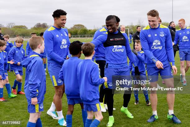 Tyias Browning, Enner Valencia and Matthew Pennington of Everton trains with the Everton Academy at USM Finch Farm on April 12, 2017 in Halewood,...