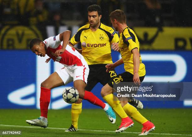 Kylian Mbappe of AS Monaco is fouled by Sokratis Papastathopoulos and Lukasz Piszczek of Borussia Dortmund in the penalty area during the UEFA...