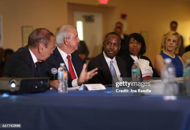 Jorge Perez, CEO, Related Urban Group, Carlos Gimenez, mayor of Miami-Dade, sit with U.S. Housing and Urban Development Secretary Ben Carson during a...