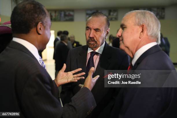 Jorge Perez, CEO, Related Urban Group and Carlos Gimenez, mayor of Miami-Dade, speak with U.S. Housing and Urban Development Secretary Ben Carson...