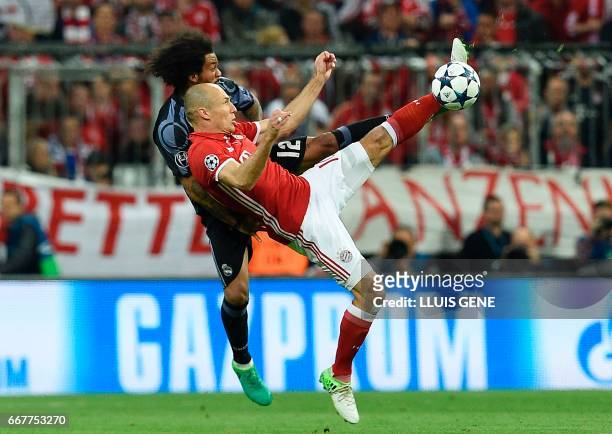 Real Madrid's Brazilian defender Marcelo and Bayern Munich's Dutch midfielder Arjen Robben vie for the ball during the UEFA Champions League 1st leg...