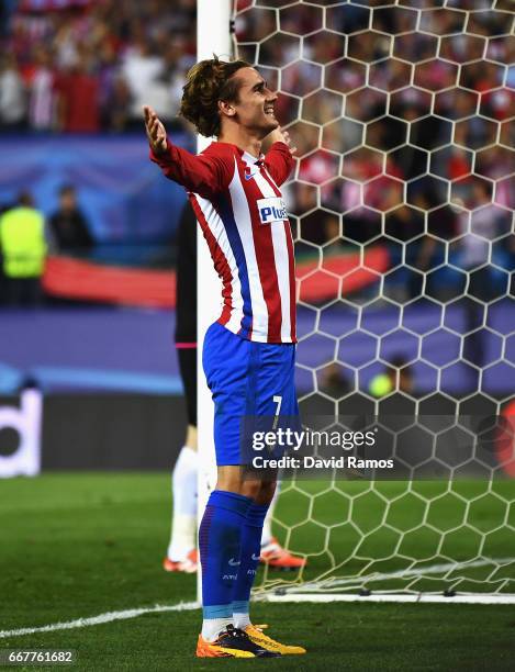 Antoine Griezmann of Atletico Madrid celebrates after scoring his team's first goal of the game from the penalty spot during the UEFA Champions...